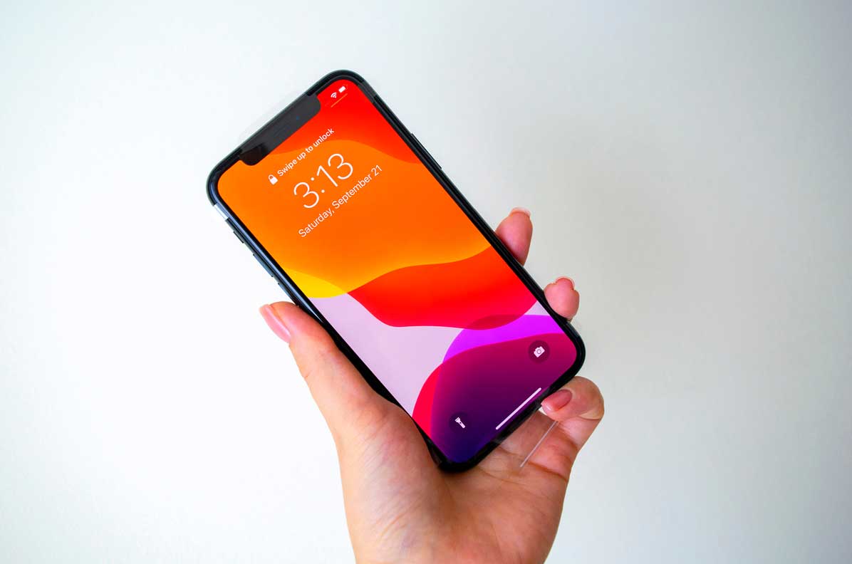 Front Side Of Apple Iphone 11 Pro In Hand On Light Background