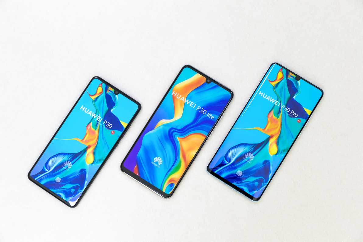 Three New Huawei P30, P30 Lite And P30 Pro Mobile Smartphones Are Displayed On Isolated White Background